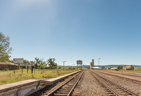 MARSEILLES, SOUTH AFRICA - MARCH 12, 2018: The railway station in Marseilles, a village in the Free State Province. Grain silos are visibleのeditorial素材