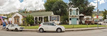 FICKSBURG, SOUTH AFRICA - MARCH 12, 2018: Cafe Chocolat, a restaurant and bar in Ficksburg in the Free State Province. Vehicles and a vintage display are visibleのeditorial素材