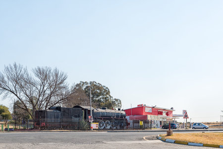 THEUNISSEN, SOUTH AFRICA, AUGUST 2, 2018: A street scene, with an historic Class 16DA steam...