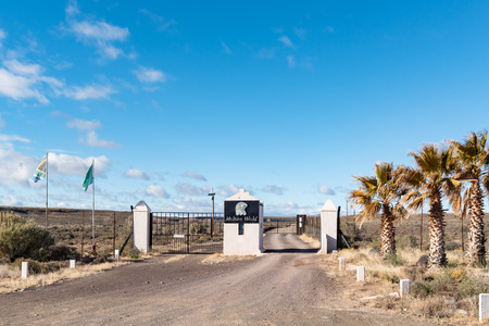 VICTORIA WEST, SOUTH AFRICA, AUGUST 7, 2018: Landscape on road R63 between Victoria West and Loxton in the Northern Cape Province. The entrance to Melton World holiday resort is visibleのeditorial素材