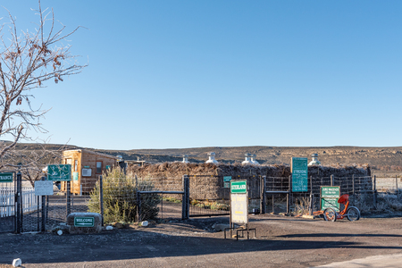 SUTHERLAND, SOUTH AFRICA, AUGUST 8, 2018: A boma and reception office at the Sterland Caravan Park at Sutherland in the Northern Cape Province. The enclosures of several 11-inch telescopes are visibleのeditorial素材