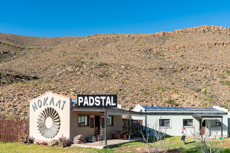 SUTHERLAND, SOUTH AFRICA, AUGUST 8, 2018: The Hokaai Road Stall on road R354 in the Verlatenkloof Pass to the South of Sutherland in the Northern Cape Province. A woman is visibleのeditorial素材