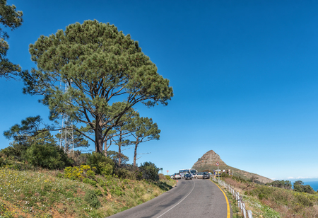 CAPE TOWN, SOUTH AFRICA, AUGUST 9, 2018: The road leading to the top of Signal Hill in Cape Town. Lions Head, people and vehicles are visibleのeditorial素材