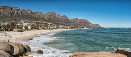 CAPE TOWN, SOUTH AFRICA, AUGUST 9, 2018: Panorama of a beach in Camps Bay in Cape Town in the Western Cape Province. The 12 Apostles, people and buildings are visibleのeditorial素材