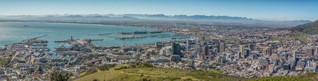 CAPE TOWN, SOUTH AFRICA, AUGUST 9, 2018: A panorama of the Victoria and Alfred Waterfront, the harbor and Central Business District of Cape Town as seen from Signal Hillのeditorial素材