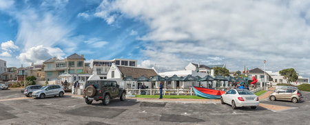 CAPE TOWN, SOUTH AFRICA, AUGUST 14, 2018: Ons Huisie, a beachfront restaurant in Bloubergstrand. Vehicles and people are visibleのeditorial素材