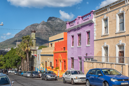 CAPE TOWN, SOUTH AFRICA, AUGUST 17, 2018: A street scene, with multi-colored houses, in the Bo-Kaap in Cape Town in the Western Cape Province. The Auwal Masjid and Devils Peak are visible in the backのeditorial素材