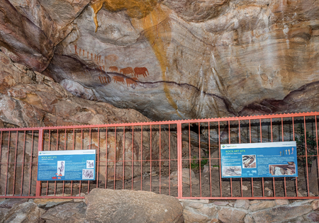 CEDERBERG, SOUTH AFRICA, AUGUST 23, 2018: San rock art at the Stadsaal Caves and Rock Art site in the Cederberg Mountains in the Western Cape Province. Rock art and information boards are visibleのeditorial素材