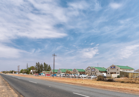 ORANIA, SOUTH AFRICA, SEPTEMBER 1, 2018: The Ou Karooplaas shopping centre in Orania in the Northern Cape Province. Vehicles are visibleのeditorial素材