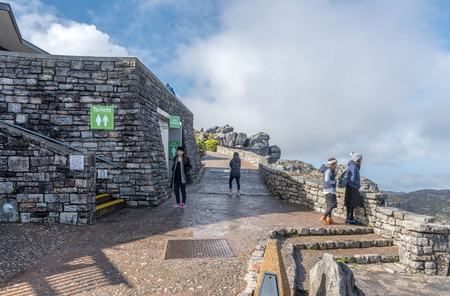 CAPE TOWN, SOUTH AFRICA, AUGUST 17, 2018: Toilet facilities on top of Table Mountain in Cape Town. People are visibleのeditorial素材