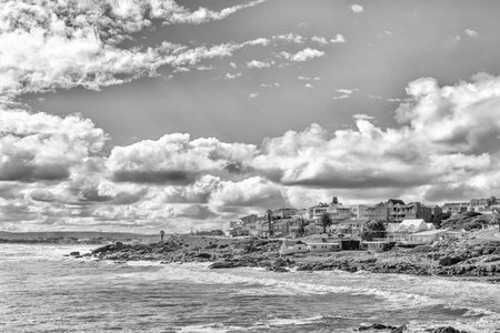 A coastal scene in Yzerfontein on the Atlantic Ocean coast in the Western Cape Province. Houses are...