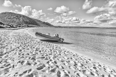 WEST COAST NATIONAL PARK, SOUTH AFRICA, AUGUST 20, 2018: A speedboat at a beach in Kraalbaai in the Langebaan Lagoon on the Atlantic Ocean coast in the Western Cape Province. Monochromeのeditorial素材