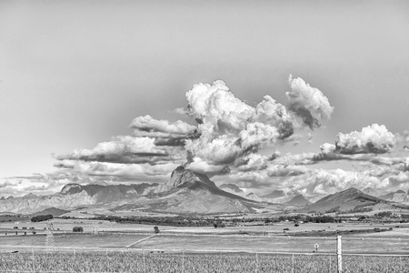 A view from road R312 towards Simonsberg and the Hottentots-Holland Mountains in the Western Cape Province. Monochromeの写真素材