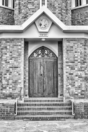 CARNAVON, SOUTH AFRICA, SEPTEMBER 1, 2018: Main entrance of the Dutch Reformed Church in Carnavon in the Northern Cape Province. Monochromeのeditorial素材