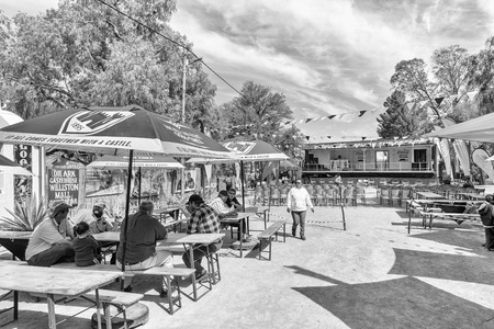 WILLISTON, SOUTH AFRICA, AUGUST 31, 2018: A street scene at the yearly Winter Festival in Williston in the Northern Cape Province. People are visible. Monochromeのeditorial素材