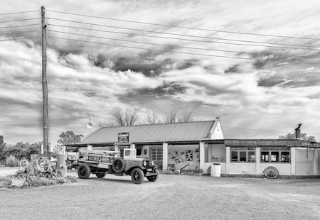 BRITSTOWN, SOUTH AFRICA, SEPTEMBER 1, 2018: The Kambro Road Stall near Britstown in the Northern Cape Province. A vintage truck is visible. Monochromeのeditorial素材