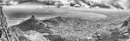 CAPE TOWN, SOUTH AFRICA, AUGUST 17, 2018: Panorama of Lions Head, Signal Hill, Robben Island and part of Cape Town as seen from the top of Table mountain. Monochromeのeditorial素材