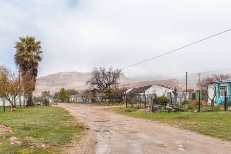 ESELBANK, SOUTH AFRICA, AUGUST 27, 2018: A street scene, with houses, in Eselbank Village in the Cederberg Mountains of the Western Cape Province. Sheep are visibleのeditorial素材
