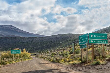 MATJIESRIVIER, SOUTH AFRICA, AUGUST 27, 2018: Directional and distance signs at the start of the road to Wupperthal at Matjiesrivier in the Cederberg Mountainsのeditorial素材
