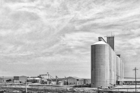 HOPETOWN, SOUTH AFRICA, SEPTEMBER 1, 2018: Grain silos and a mill at Hopetown in the Northern Cape Province. Monochromeのeditorial素材