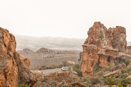 STADSAAL CAVES, SOUTH AFRICA, AUGUST 26, 2018: Snow is falling at the parking area at the Stadsaal...