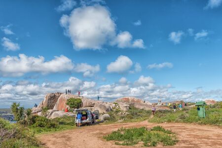 WEST COAST NATIONAL PARK, SOUTH AFRICA, AUGUST 20, 2018: Tourists at the Perlemoen Lookout Point at Postberg near Langebaan on the Atlantic Ocean coast in the Western Cape Province. A vehicle is visibleのeditorial素材