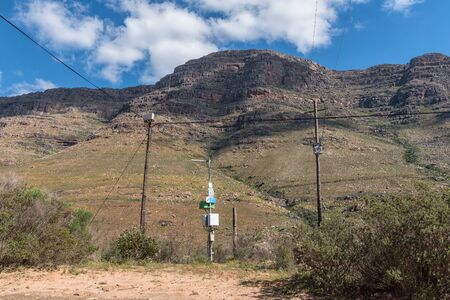 CEDERBERG, SOUTH AFRICA, AUGUST 22, 2018: Telecommunications and electricity infrastructure near Bosdorp in the Cederberg Mountains of the Western Cape Province of South Africaのeditorial素材