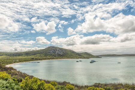 WEST COAST NATIONAL PARK, SOUTH AFRICA, AUGUST 20, 2018: A view of Kraalbaai at the Langebaan Lagoon on the Atlantic Ocean coast in the Western Cape Province. A jetty and houseboats are visibleのeditorial素材