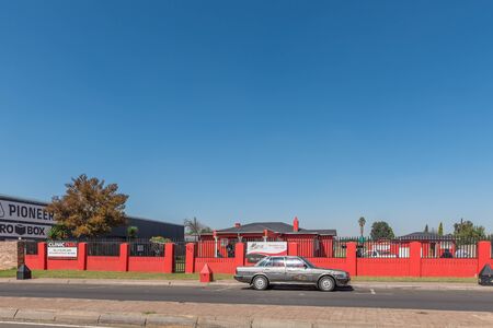 HENDRINA, SOUTH AFRICA - MAY 2, 2019: A street scene, with an occupational health services clinic, in Hendrina, in the Mpumalanga Province. A vehicle is visibleのeditorial素材