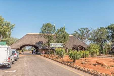 KRUGER NATIONAL PARK, SOUTH AFRICA - MAY 3, 2019: The Malelane entrance gate to the Kruger National Park. Vehicles and people are visibleのeditorial素材