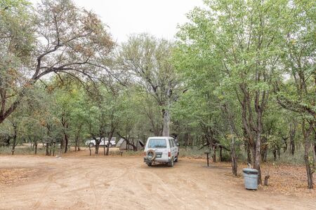KRUGER NATIONAL PARK, SOUTH AFRICA - MAY 12, 2019: A camping site at the Tsendze Rest Camp. Vehicles and tents are visibleのeditorial素材