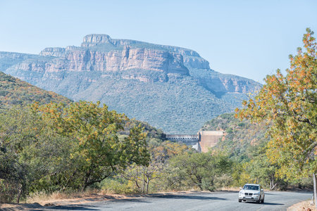BLYDE RIVER CANYON, SOUTH AFRICA - MAY 19, 2019: A view of the Blyderivierspoort Nature Reserve. The Blyderivierspoort Dam wall and a vehicle are visibleのeditorial素材