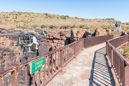 BOURKES LUCK, SOUTH AFRICA - MAY 20, 2019: A pedestrian bridge over the Treur River at Bourkes Luck Potholes. Tourists are visibleのeditorial素材