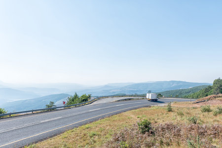 LONG TOM PASS, SOUTH AFRICA - MAY 21, 2019: The Long Tom Pass between Sabie and Lydenburg as seen from the Long Tom Cannon Monument. A vehicle is visibleのeditorial素材