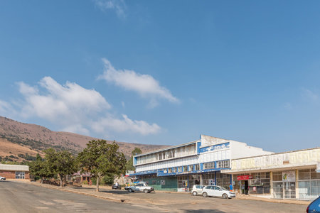 WATERVAL BOVEN, SOUTH AFRICA - MAY 22, 2019: A street scene, with a shopping centre, people and...
