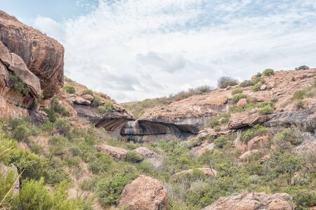 Landscape on the Cannibal Hiking Trail near Clarens in the Free State Province. The Bat Wing Waterfall is visibleの写真素材