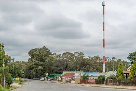 WINBURG, SOUTH AFRICA - MARCH 1, 2020: A street scene, with a cell phone tower, gas station and other buildings, in Winburg. Vehicles are visibleのeditorial素材