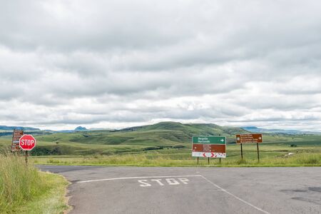 Junction between roads D119 and D475 near Bonjaneni in Kwazulu-Natal. A stop sign and directional signs are visibleの写真素材