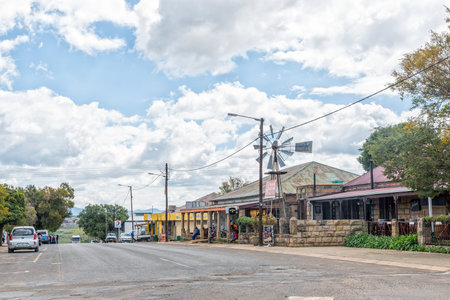 FOURIESBURG, SOUTH AFRICA - MARCH 18, 2020: A street scene, with businesses, people and vehicles, in...