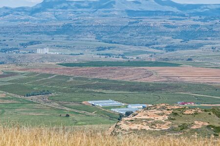 Aerial view from the mountain at Uithoek. The Bloukruin Manitoba farm and the silos at Fouriesburg railway station are visibleの写真素材