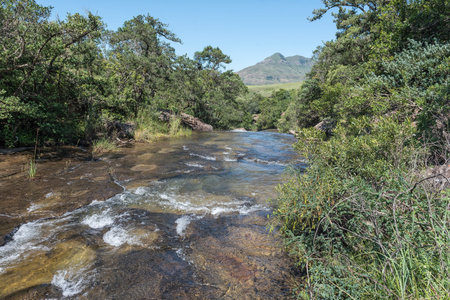 The Mahai River cascading over rocks upstream from the Cascades