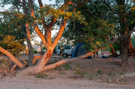 ABA HUAB, NAMIBIA - MAY 29, 2011: Sunset view from the river towards the Aba Huab Campsite in Damaraland in Namibiaのeditorial素材