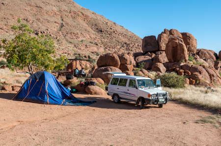 KOIIMASIS, NAMIBIA - JUNE 13, 2011: Camping scene at Ranch Koiimasis in southern Namibia. A vehicle and tent are visibleのeditorial素材