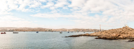 LUDERITZ, NAMIBIA - JUNE 15, 2011: A panoramic view of Luderitz as seen from Shark Island. Boats and...