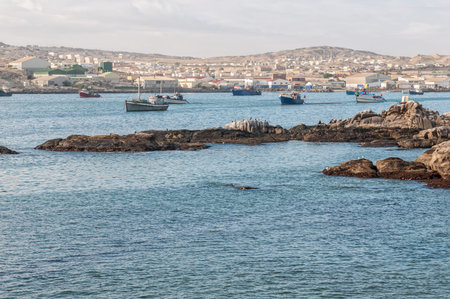 LUDERITZ, NAMIBIA - JUNE 15, 2011: A view of Luderitz as seen from Shark Island. Boats and people are visibleのeditorial素材