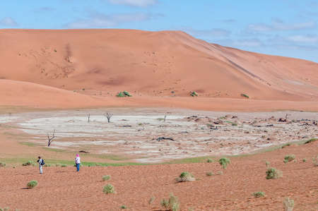 SOSSUSVLEI, NAMIBIA - JUNE 11, 2011: A view of part of Deadvlei. Tourists are visibleのeditorial素材