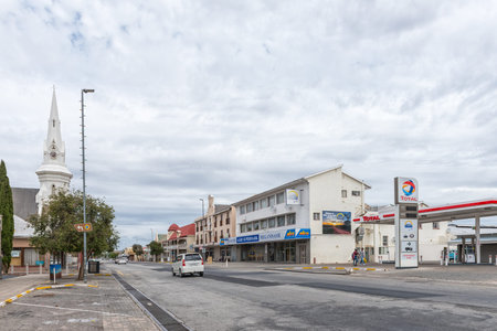 BEAUFORT WEST, SOUTH AFRICA - APRIL 2, 2021: A street scene in Beaufort West in the Western Cape Karoo. Vehicles, people and buildings are visibleのeditorial素材