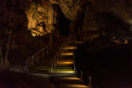 OUDTSHOORN, SOUTH AFRICA - APRIL 5, 2021: Stairs and rock formations in the Cango Caves near Oudthoorn in the Western Cape Karooのeditorial素材