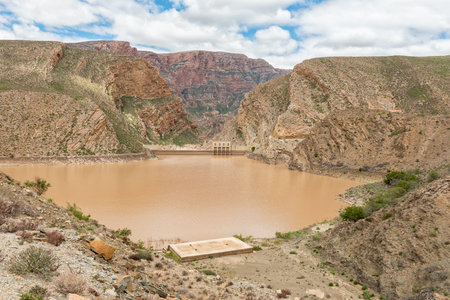 View of the Gamkapoort Dam in the Swartberg mountains. The dam wall is visible
