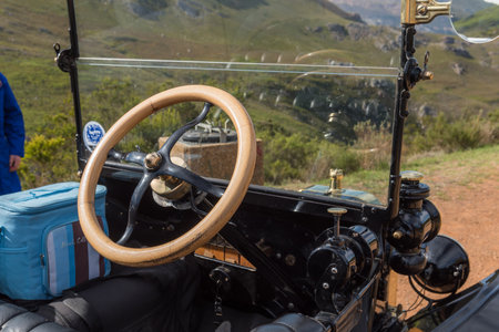 FRANSCHHOEK, SOUTH AFRICA - APRIL 12, 2021: Wooden steering wheel of a Model-T Ford from 1915. Franschhoek Pass in the Western Cape Provinceのeditorial素材